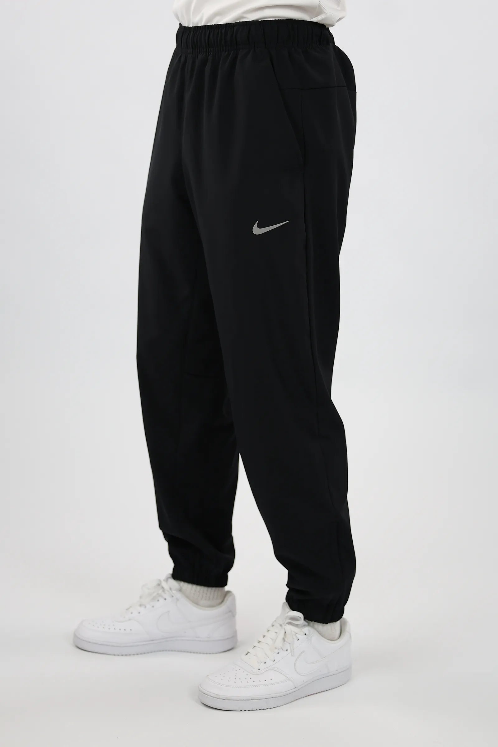 TRENERK NIKE DRI-FIT TAPERED VERSATILE TROUSERS