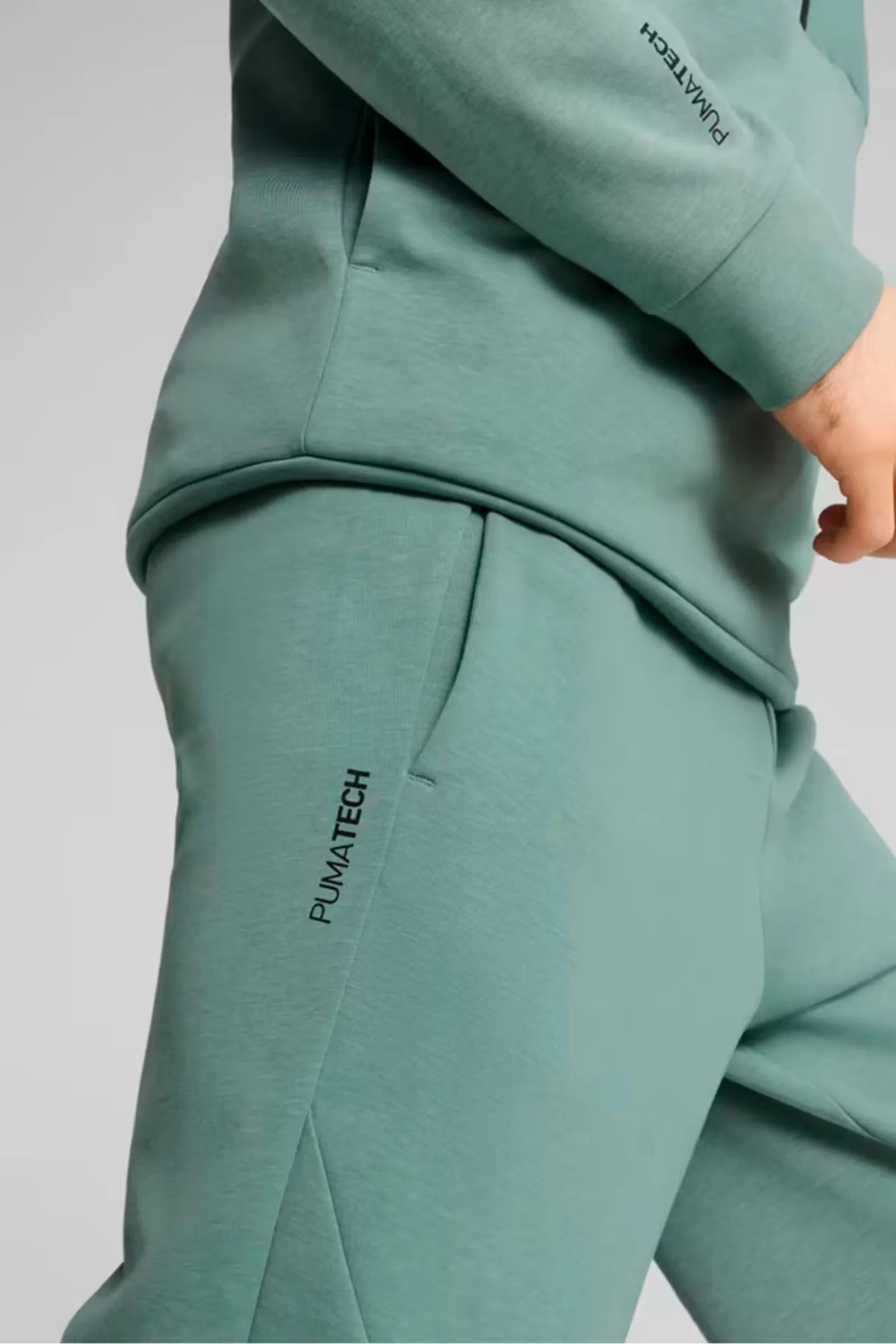 TRENERKA PUMA GREEN MENS EVOSTRIPE TROUSERS